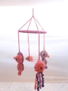Móvil océano rosa