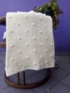 Manta con pelotitas